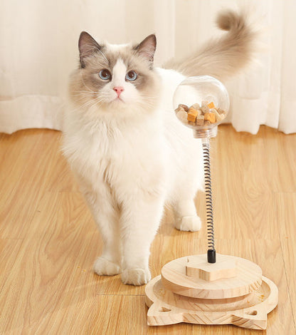 Treat dispensing spring-loaded cat toy